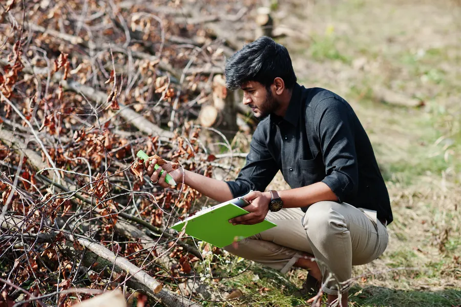 Agronomist with clipboard assessing a farm